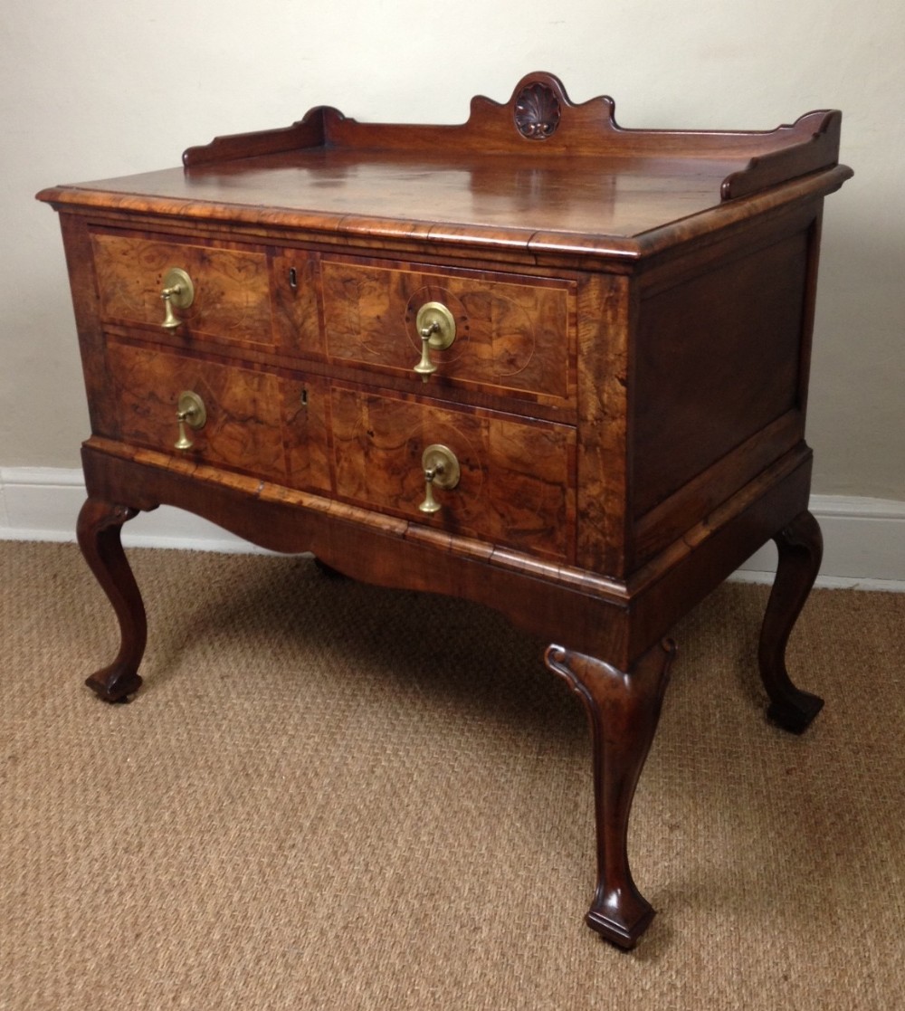 A Queen Anne style walnut chest on stand c 1890