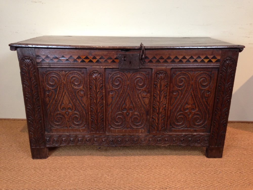 A Charles 11 carved oak coffer c 1660