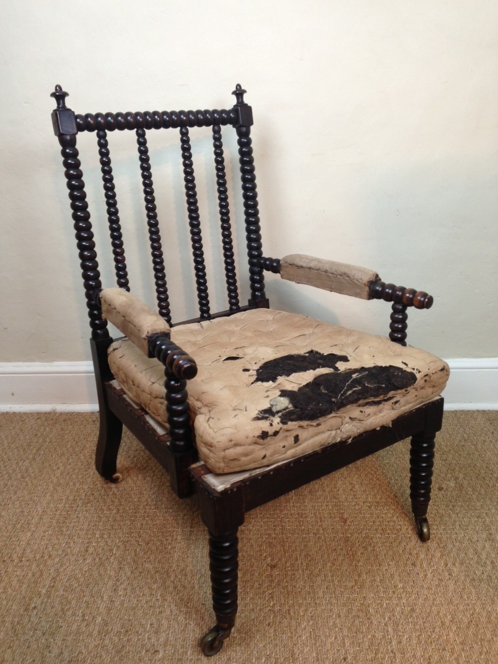 A mid 19th century simulated rosewood bobbin arm chair c 1840