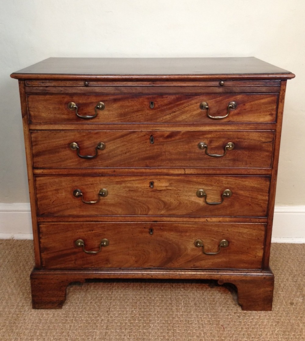 A small George 111 mahogany chest of drawers c 1780 with brushing slide