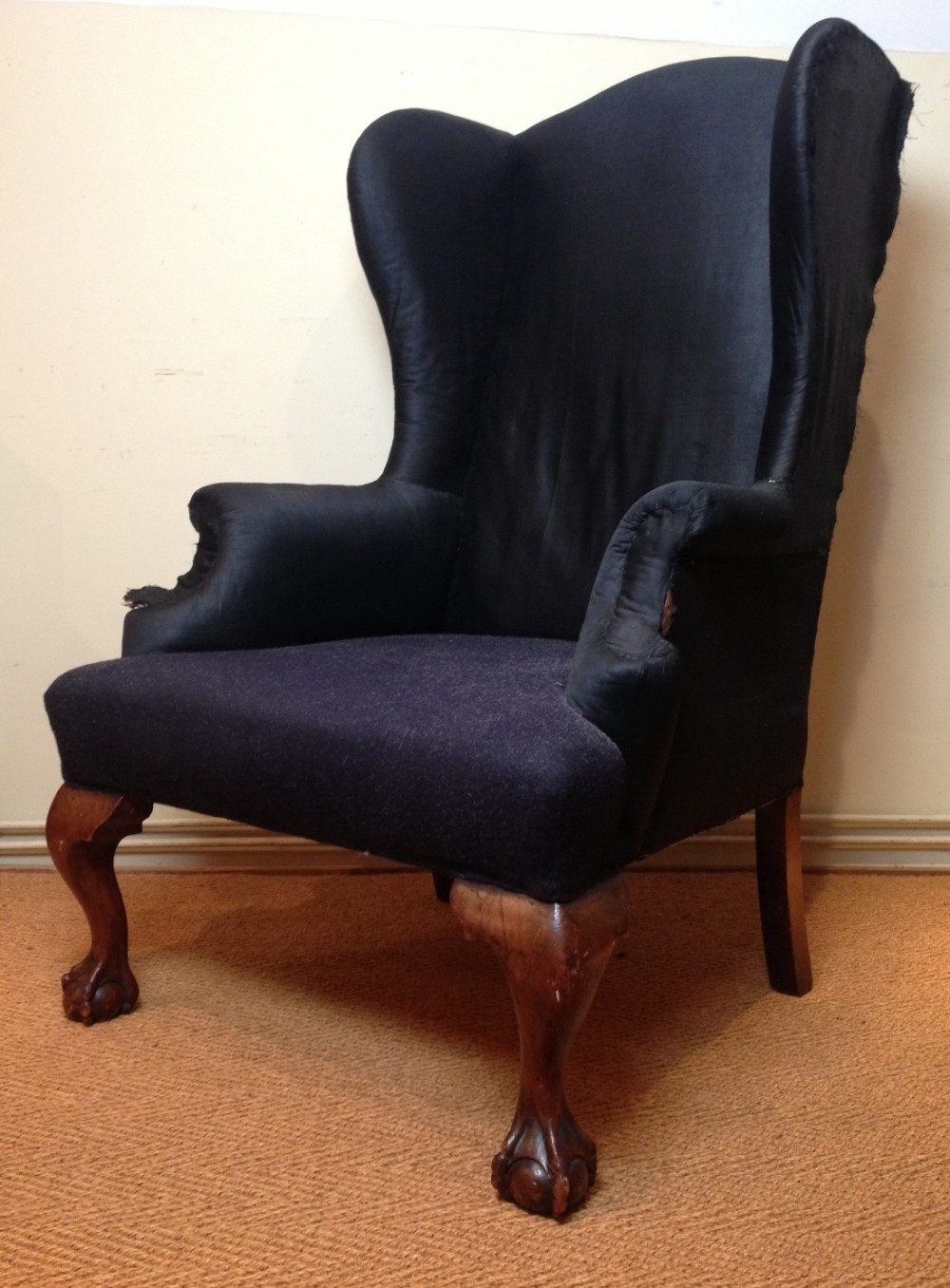 A late Victorian walnut wing armchair c 1890 in Georgian style