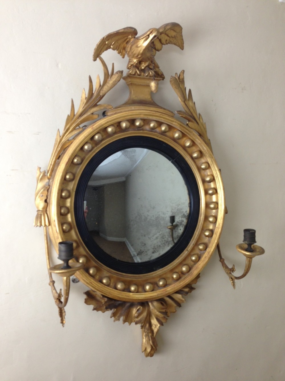 A small Regency giltwood convex mirror c 1815