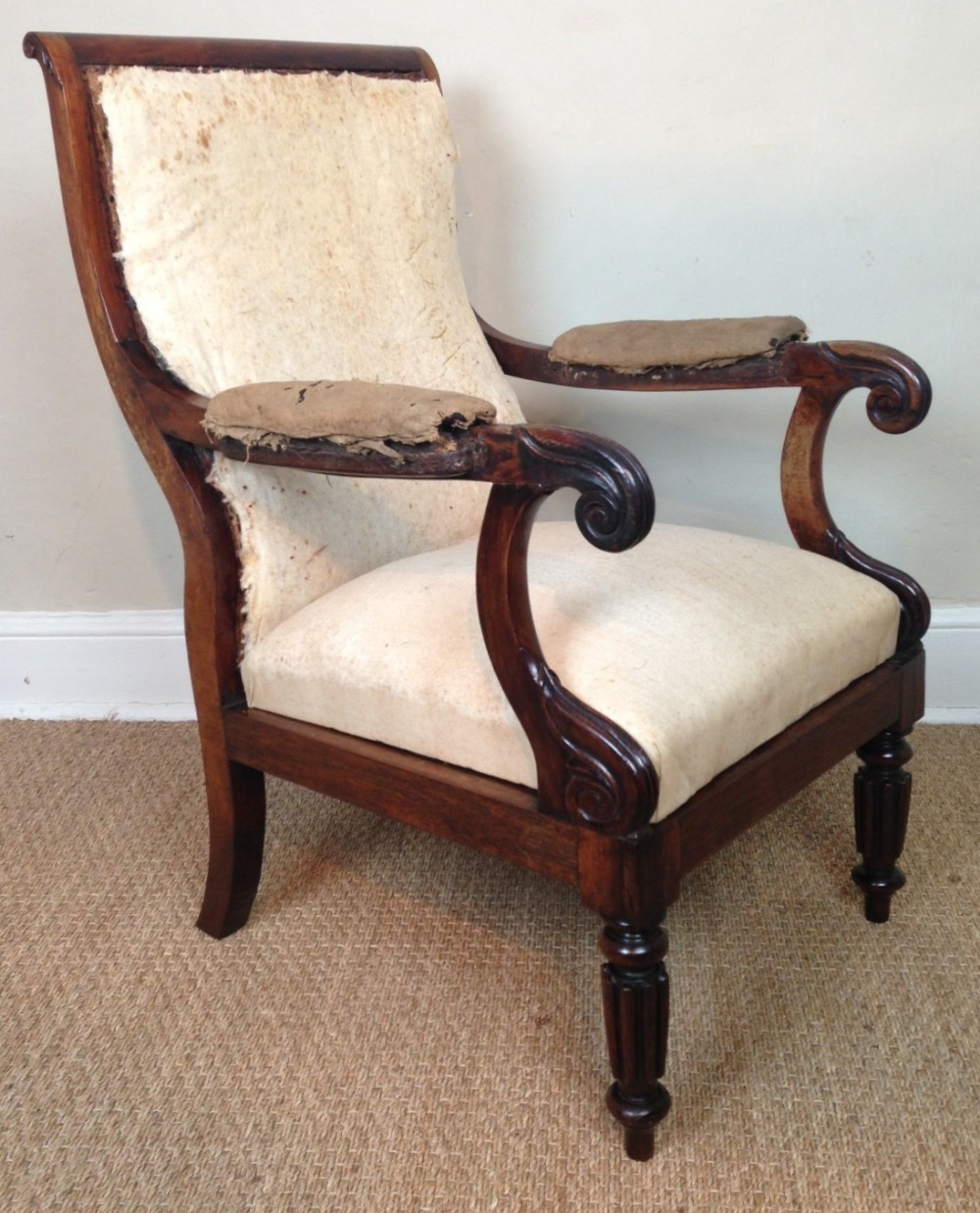 A stylish late Regency rosewood armchair for recovering c 1830