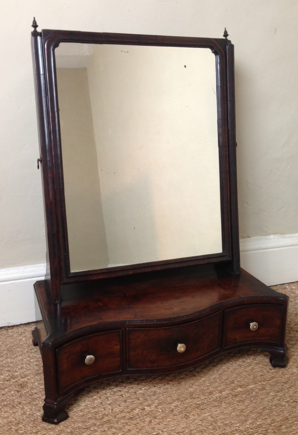 An oversized early George 111 dressing table mirror c 1760