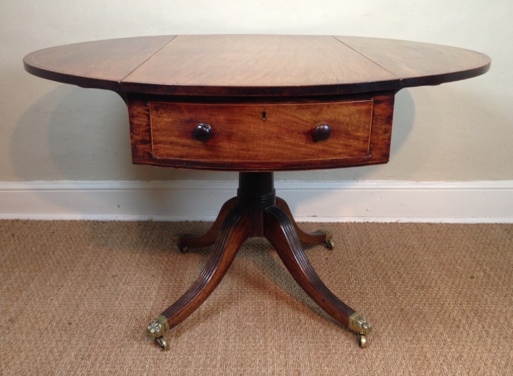 A George III mahogany oval drum Pembroke table c 1800