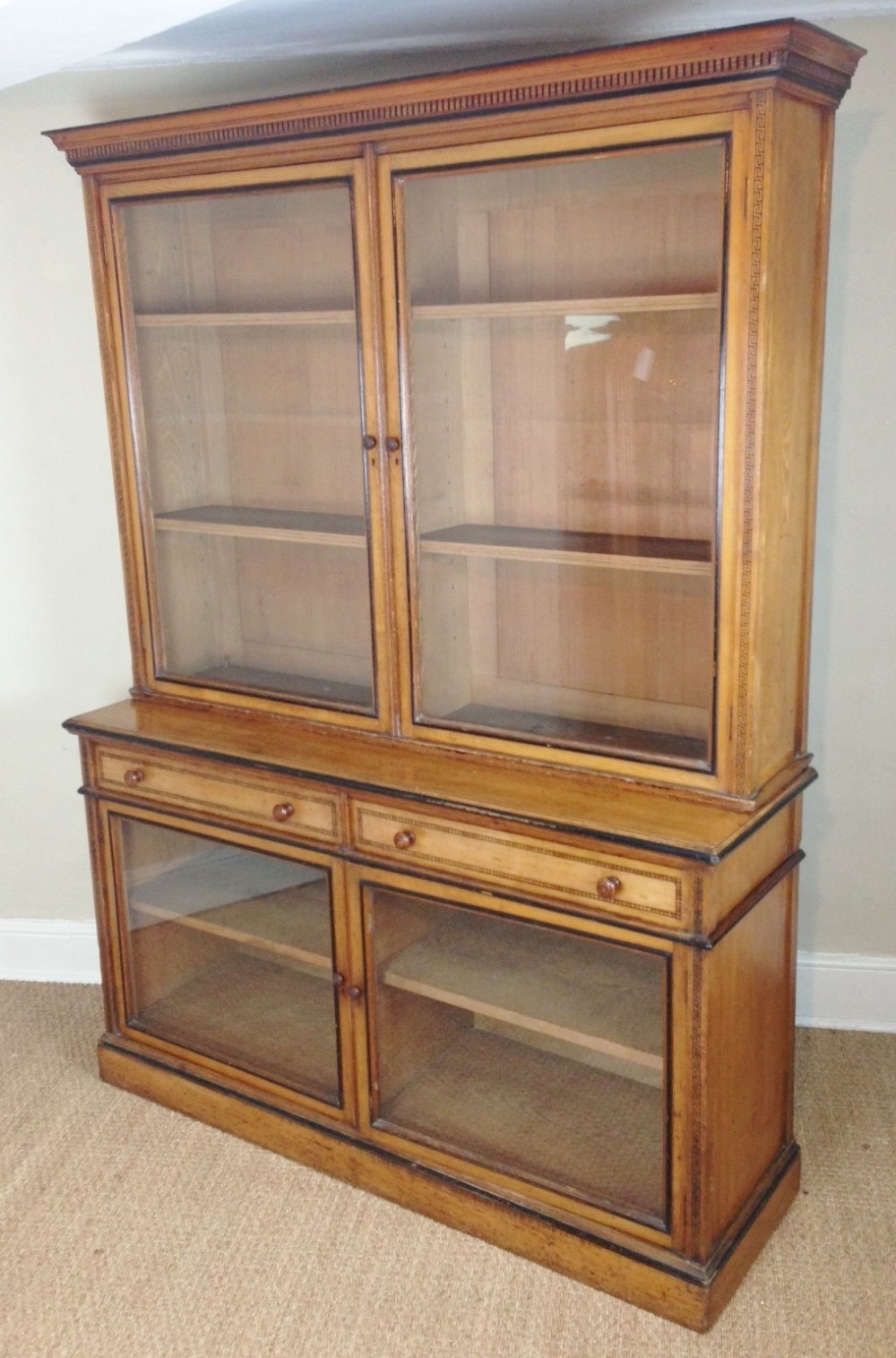 A Gothic Reform ash and ebonised library bookcase c 1870