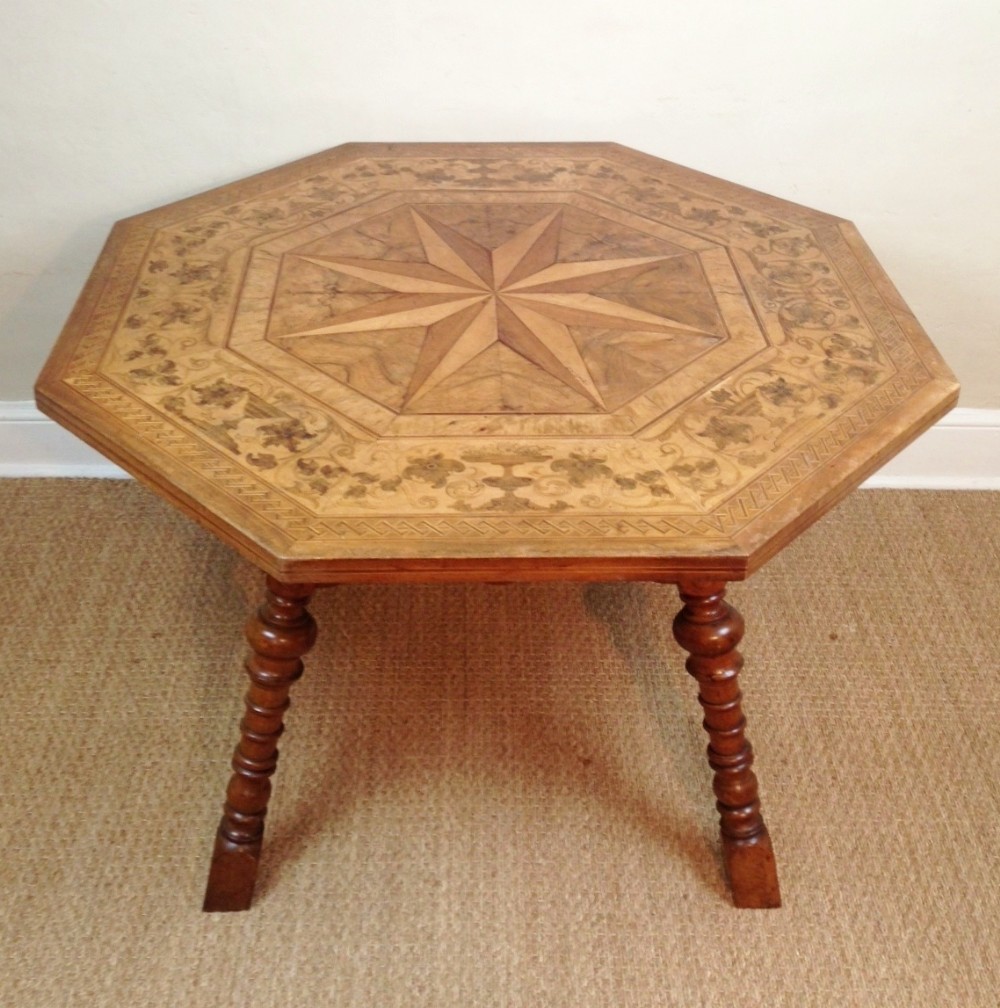 A Swiss octagonal fruitwood marquetry centre table c 1880