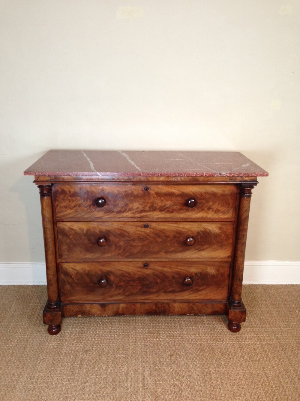 A mid 19th c mahogany and marble top chest of drawers c 1840