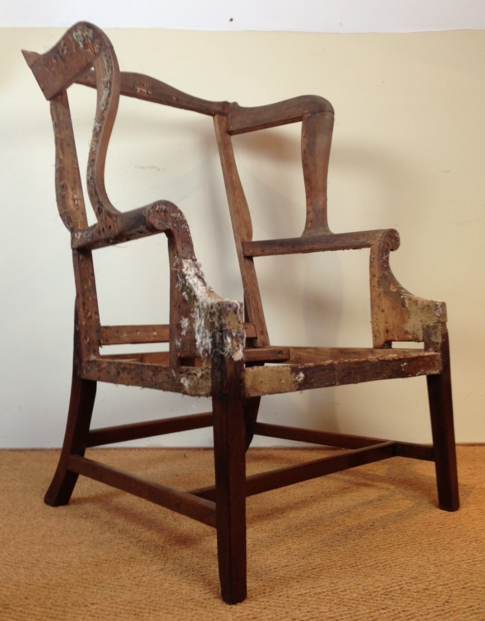 A large George 111 mahogany wing chair frame c 1780