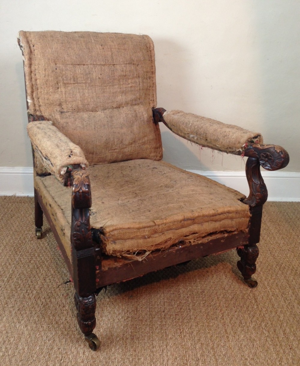 A large Victorian walnut library armchair c 1860 