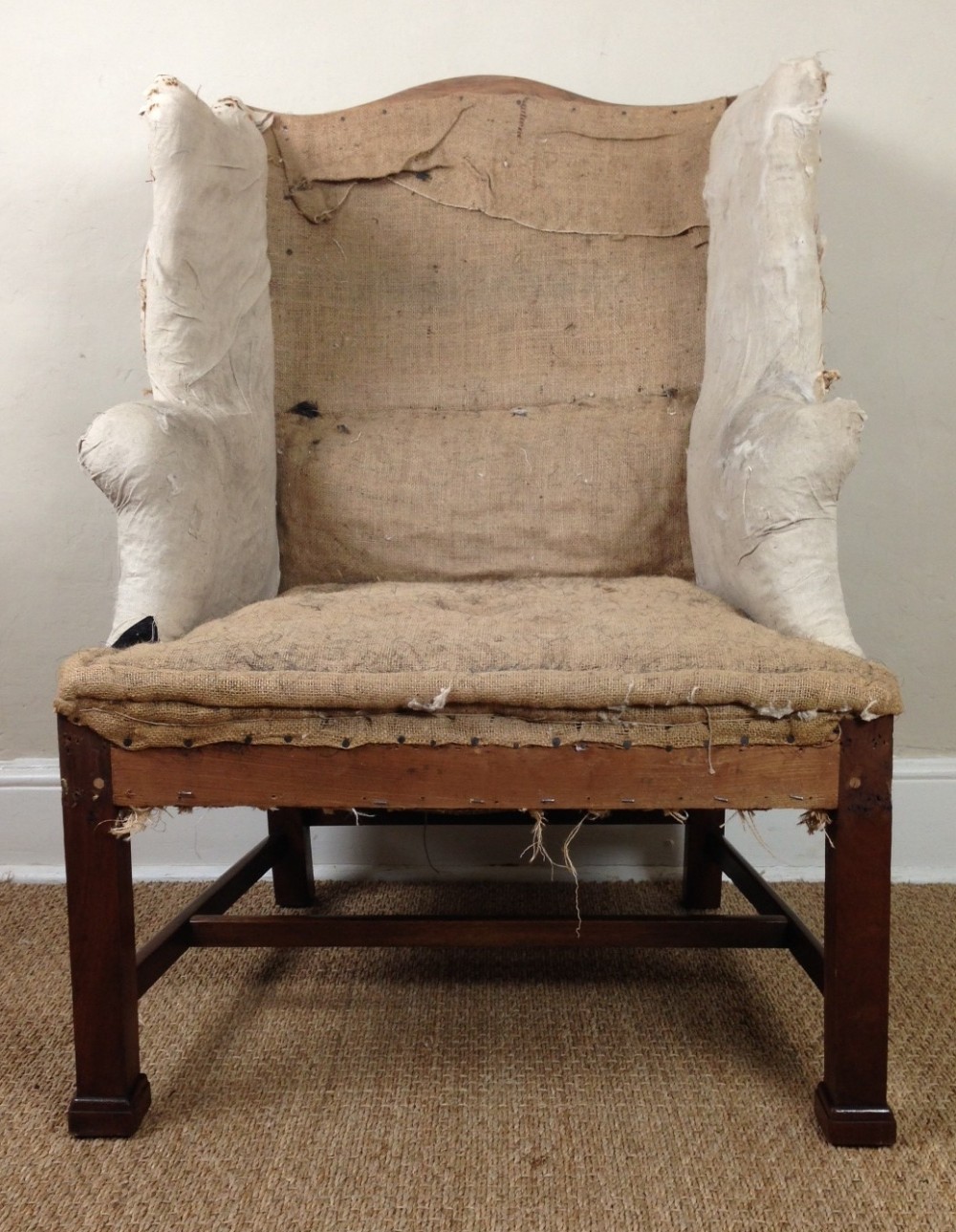 A stylish Georgian style mahogany wing chair c 1890