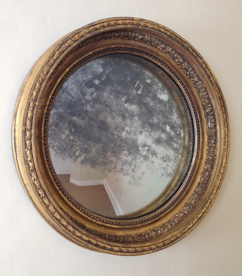 A George III gilt convex mirror c 1810