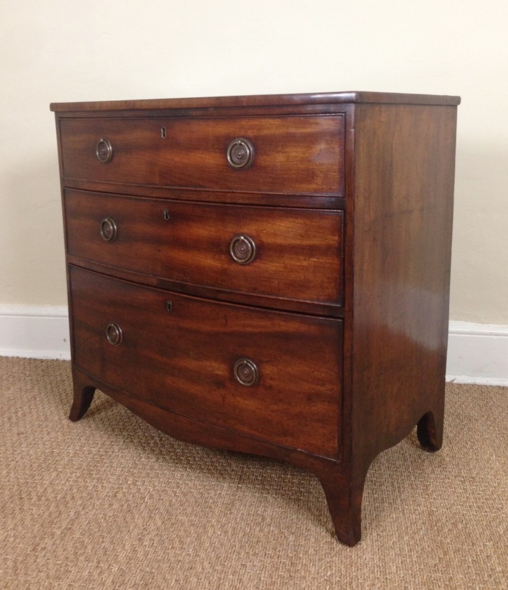 An unusually small Regency mahogany bowfront chest of drawers c 1820