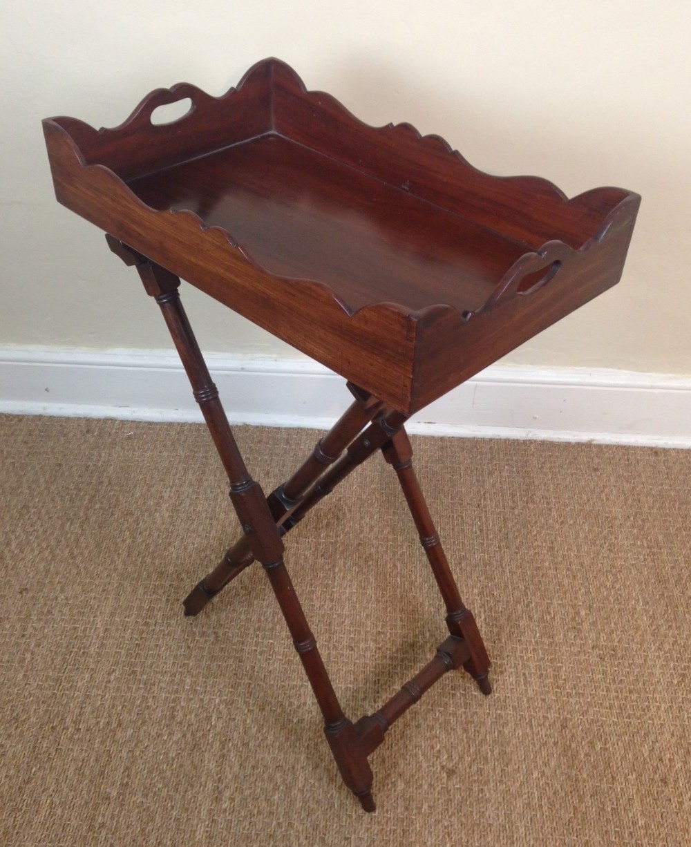 An unusually small Regency mahogany Butlers Tray on stand c 1820