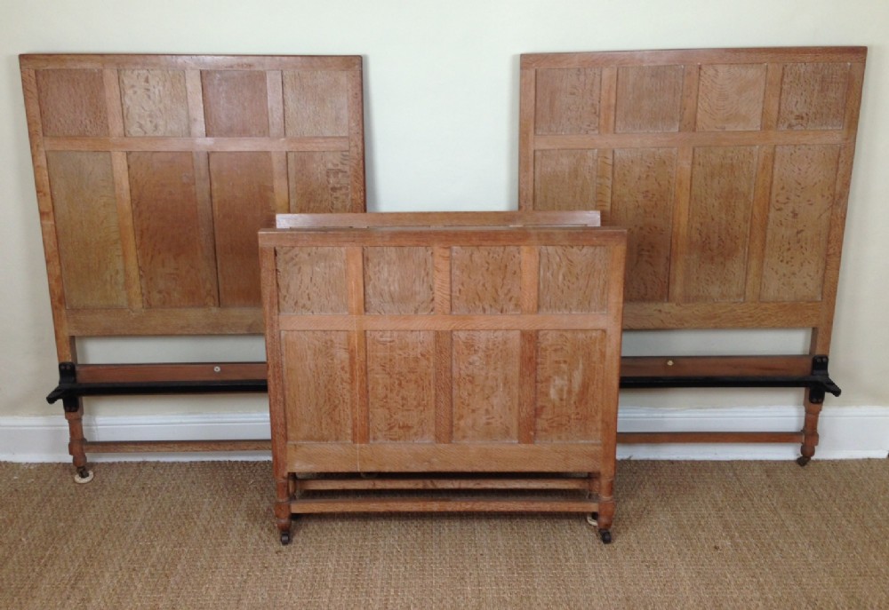 A pair of Heals oak beds c 1930 