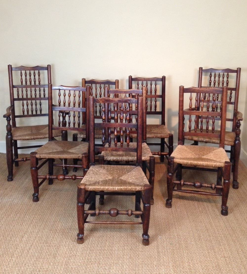 A harlequin set of 8 late C 18th Lancashire spindle back chairs