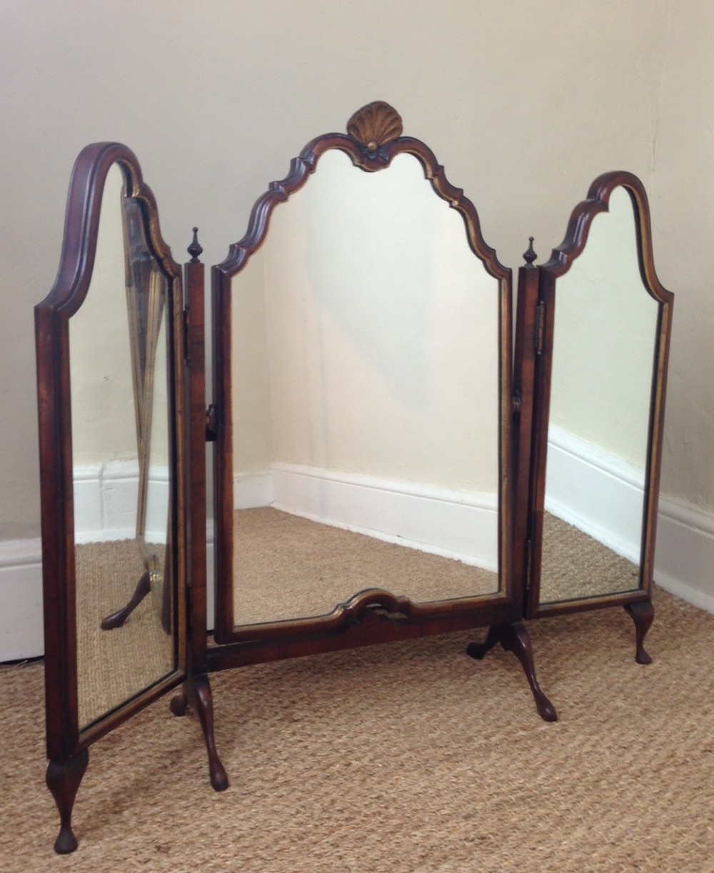 An Edwardian walnut and parcel gilt tryptych mirror c 1910