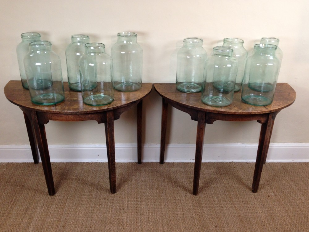 A matched set of late 19th Green glass storage jars 