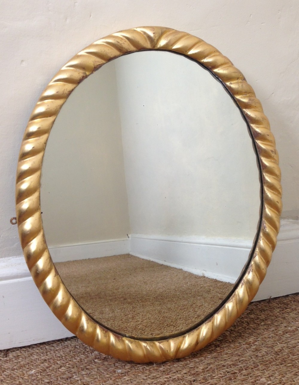 An early Victorian gilt oval mirror c 1840