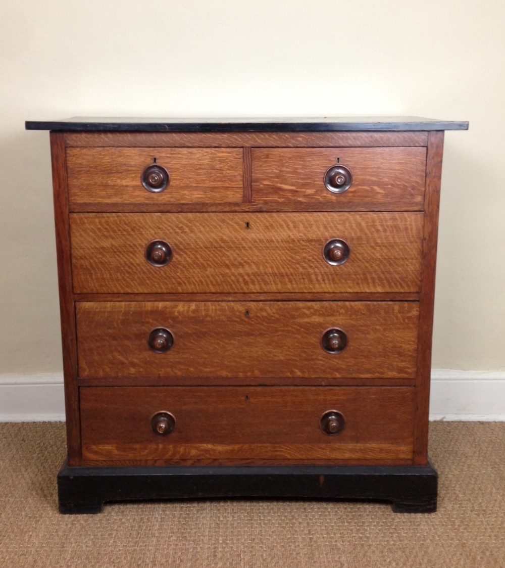A Liberty oak and ebonised chest of drawers c 1900
