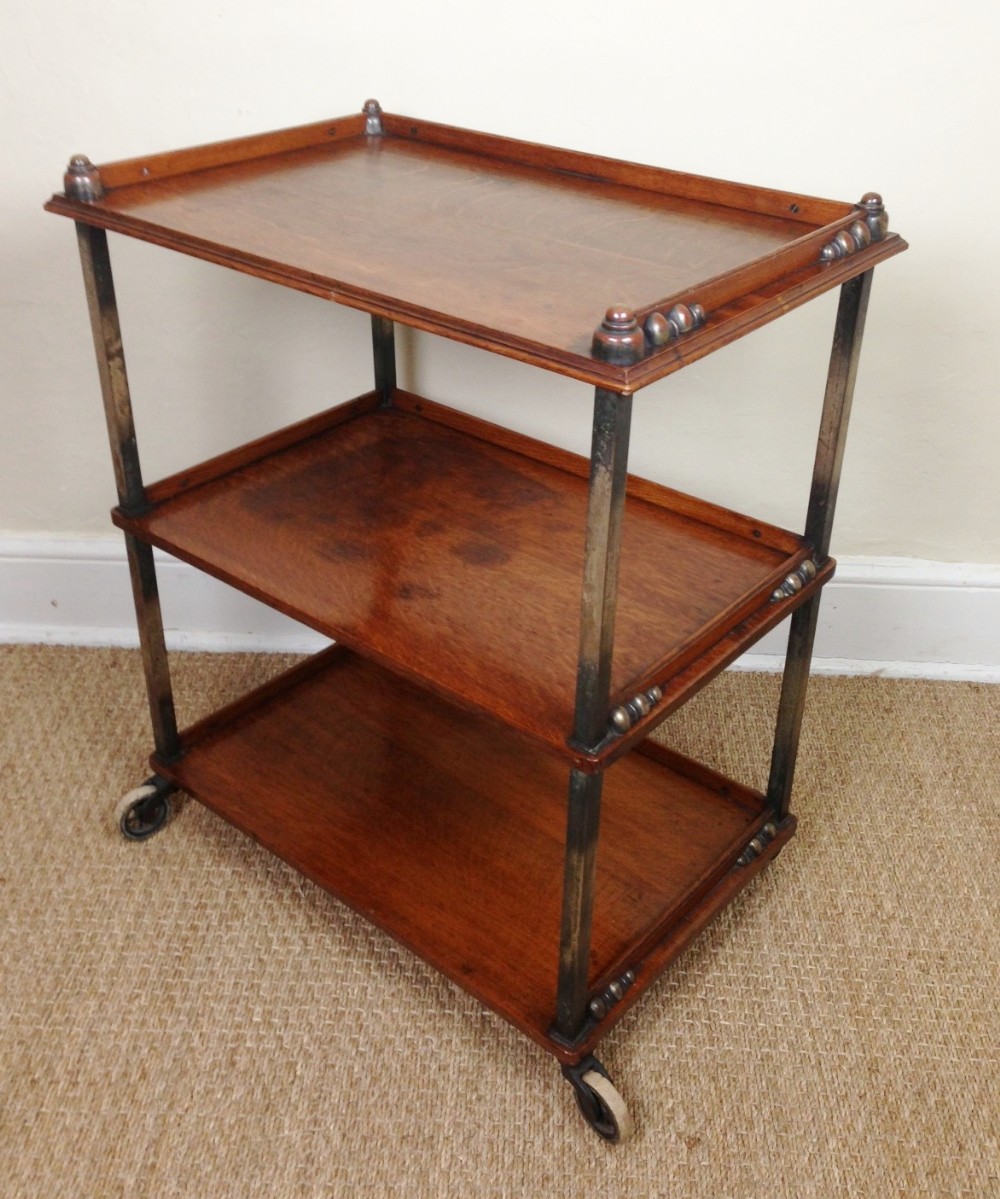 A rare Edwardian oak and anodised brass 3 tier trolley c 1910