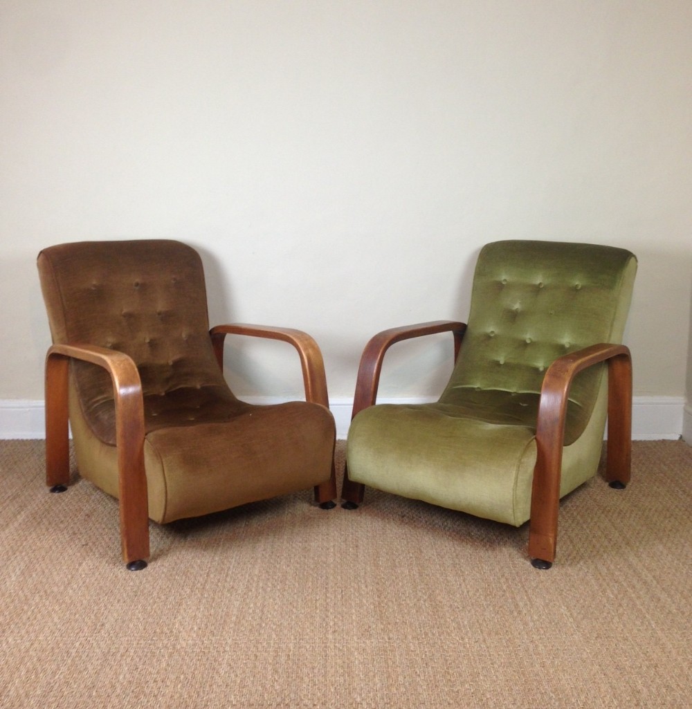A pair of English Art Deco oak armchairs c 1935