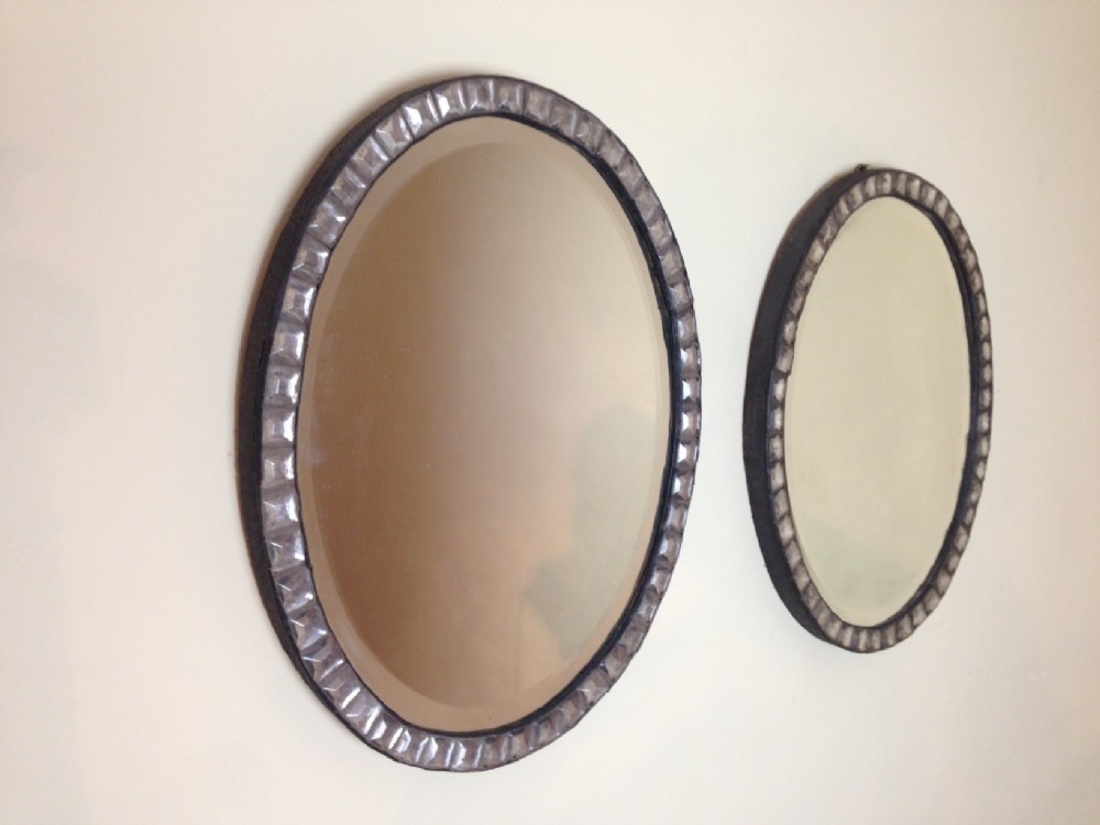A rare pair of mid 19th c Irish oval mirrors with original hand bevelled mirror plates and faceted studs. 