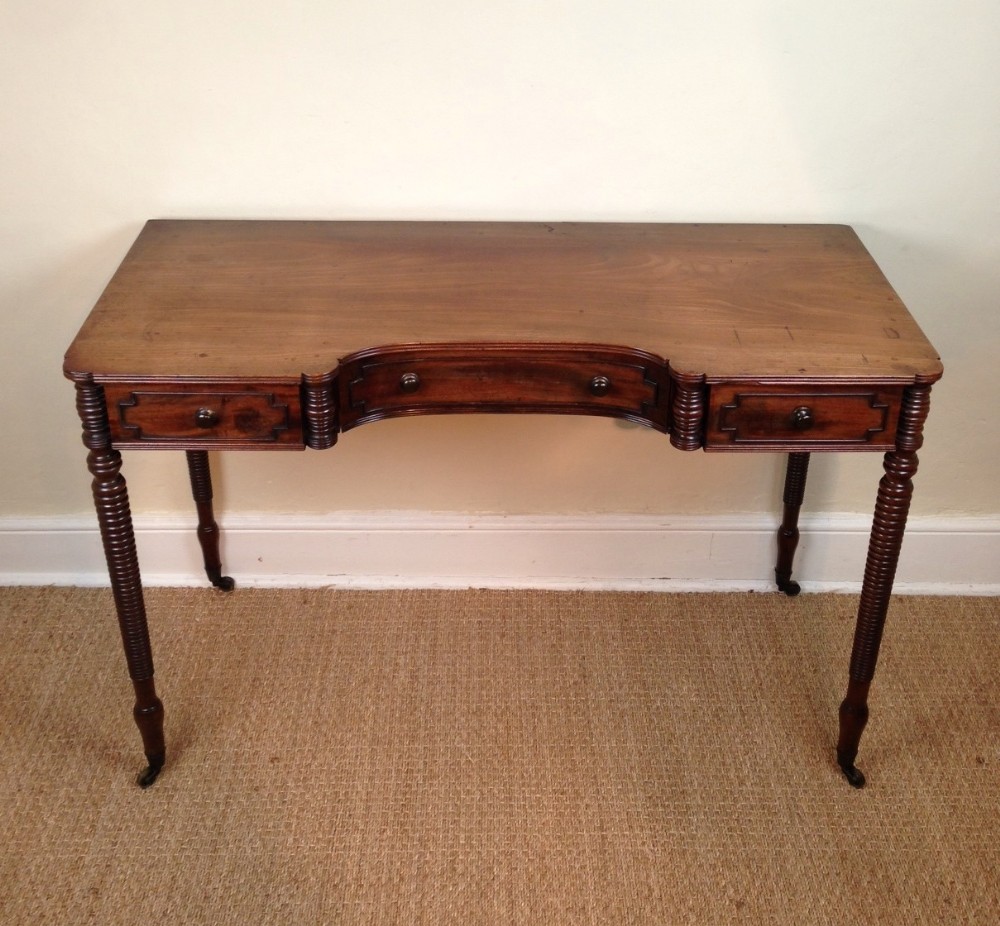 A George IV mahogany concave fronted dressing table c 1830 