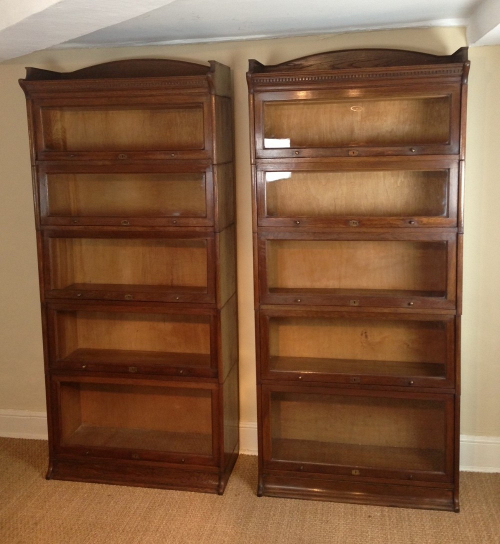 A pair of Edwardian oak Lebus bookcases c 1910