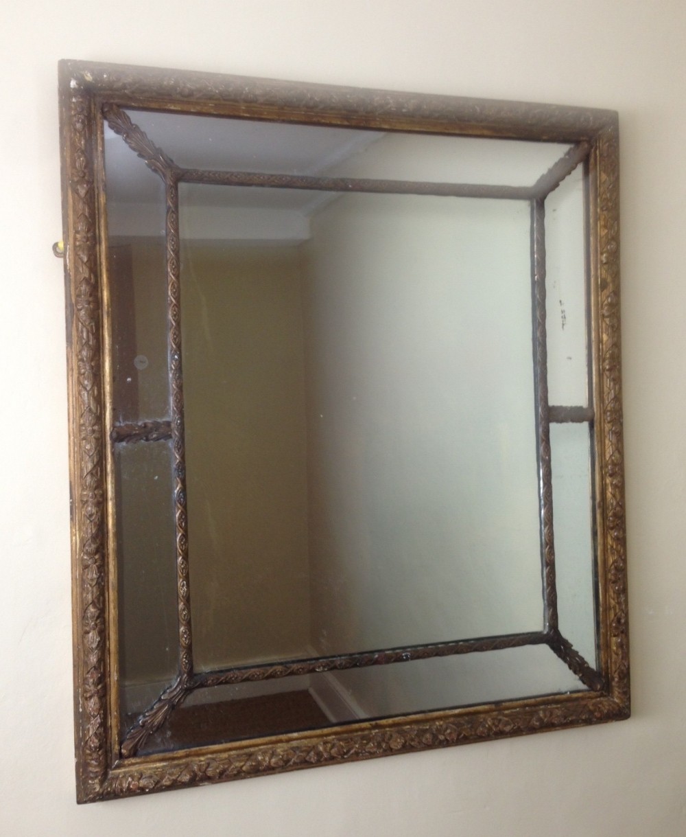 A George IV gilt and gilt brass mounted border glass mirror c 1825