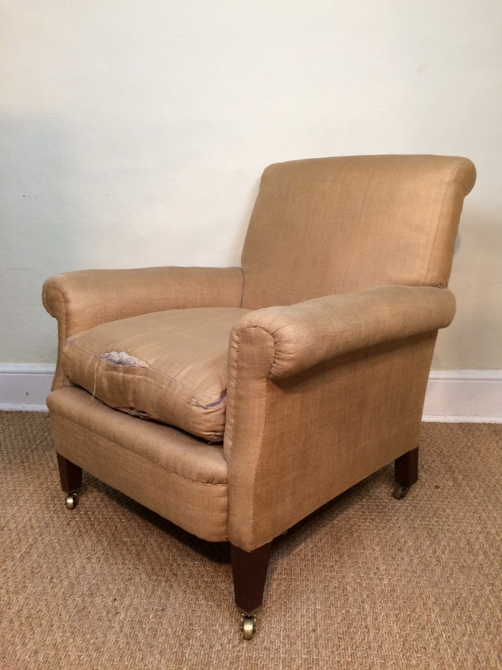 An Edwardian mahogany armchair for re covering in the original hessian c 1910