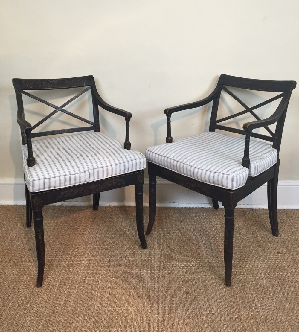 A pair of Regency ebonised and painted armchairs c 1820 