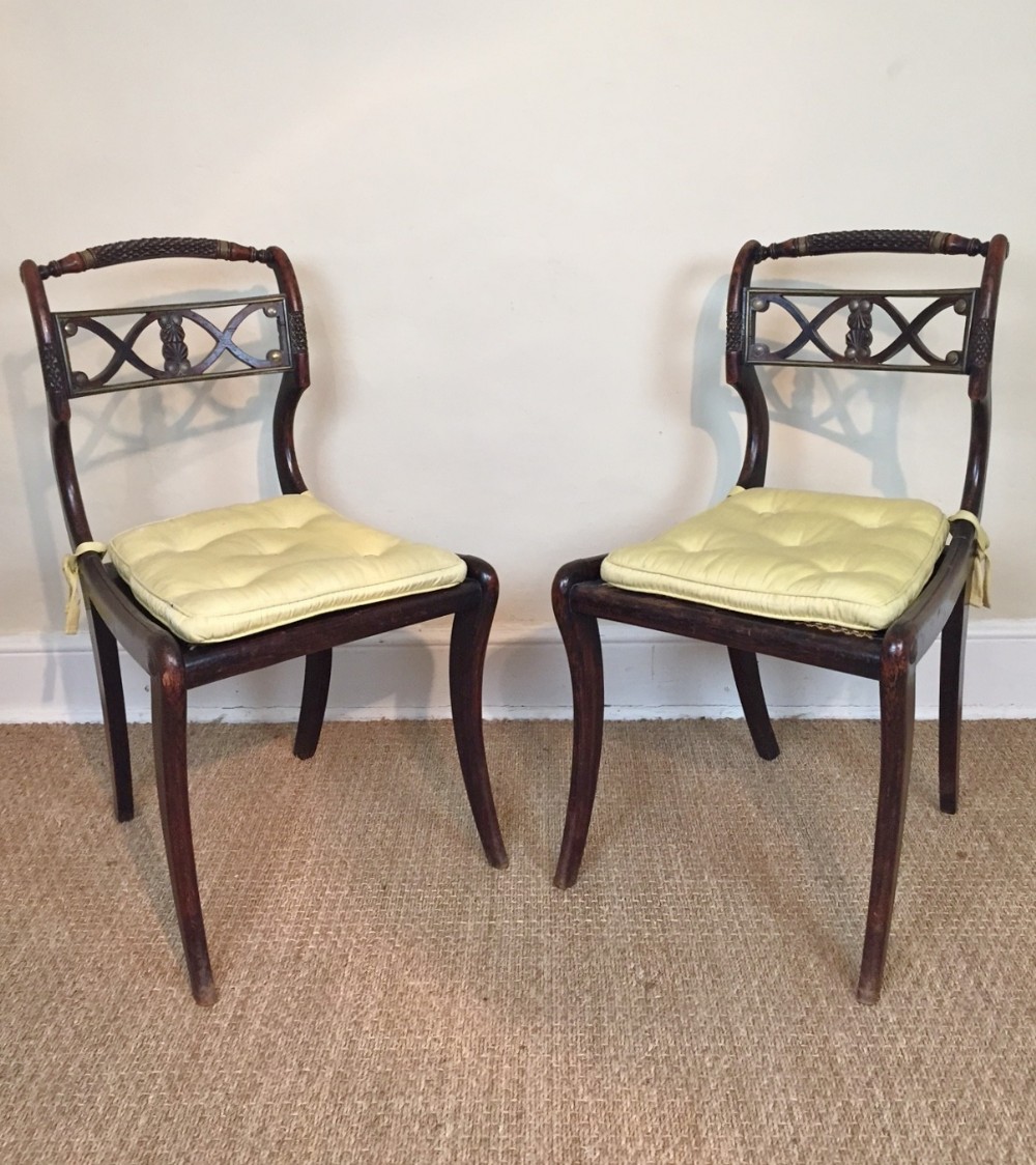 A pair of Regency simulated rosewood and gilt metal mounted side chairs c 1815 