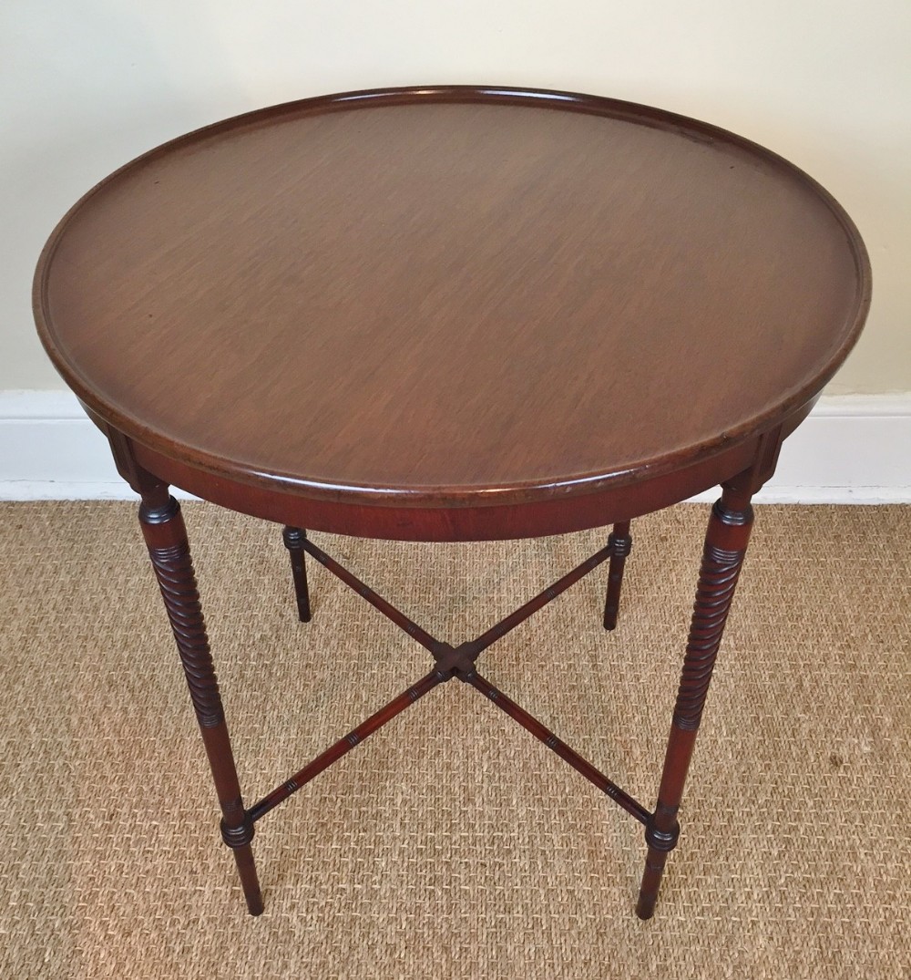 An Aesthetic movement circular walnut table c 1880