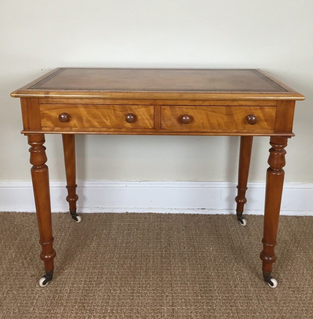 A Victorian satinbirch writing table by Heals c 1880