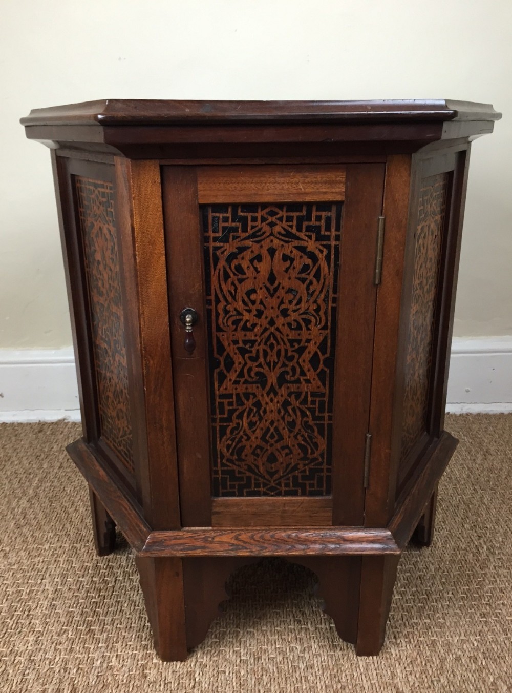 A late Victorian mahogany and poker work hexagonal book table c 1900 attributed to Morris and Co.