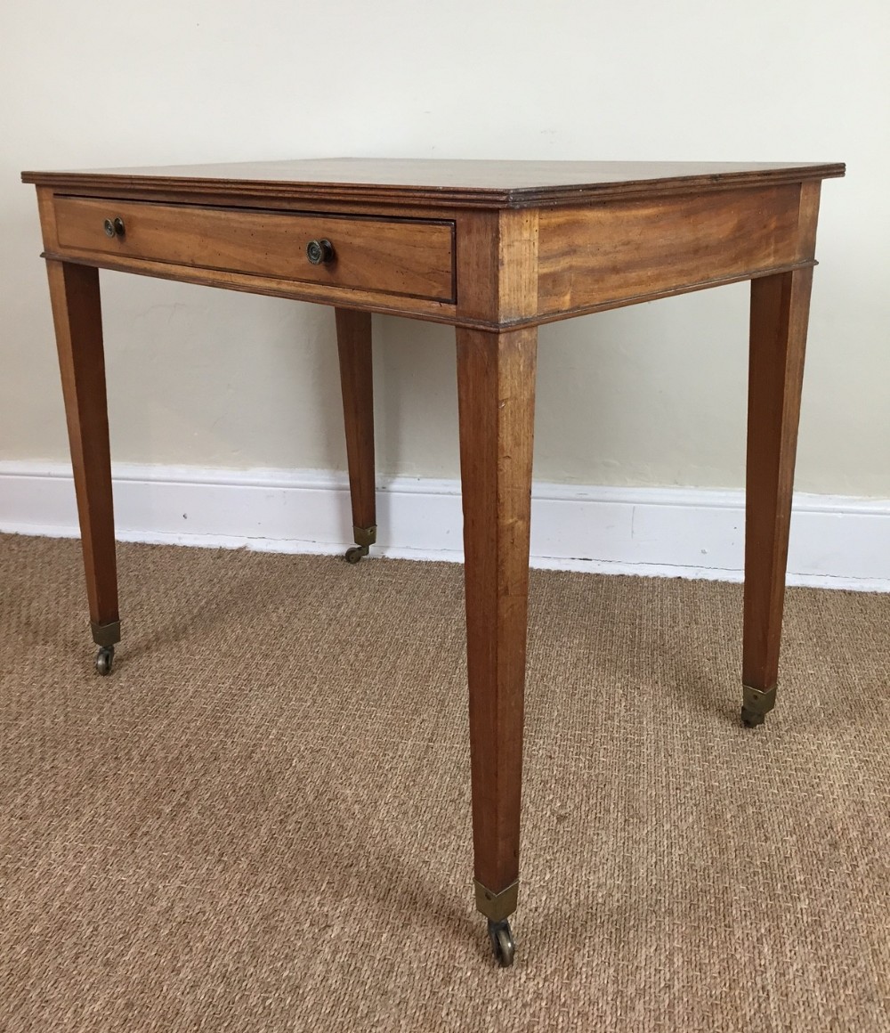 A George IV faded mahogany writing table c 1820