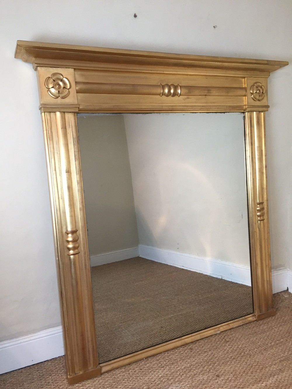 A large late Regency gilt wood overmantel mirror c 1830