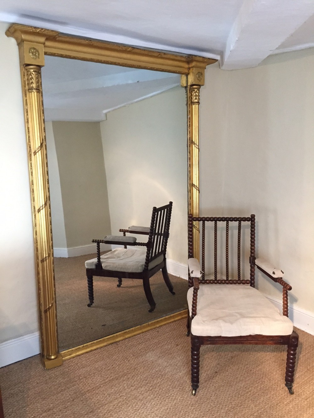 An enormous George 111 gilt wood over mantel mirror c 1820