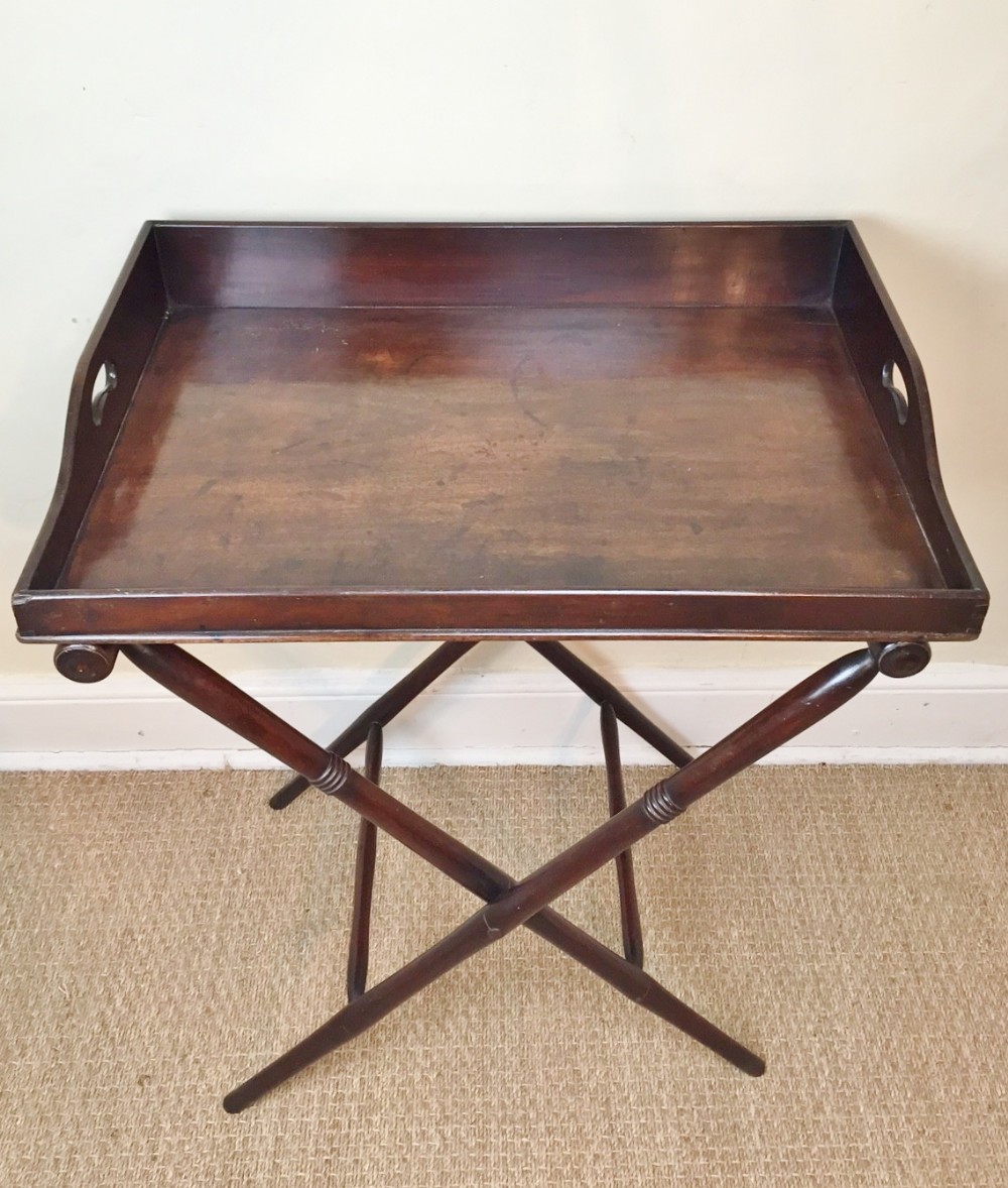 A George IV mahogany butlers tray on stand c 1830