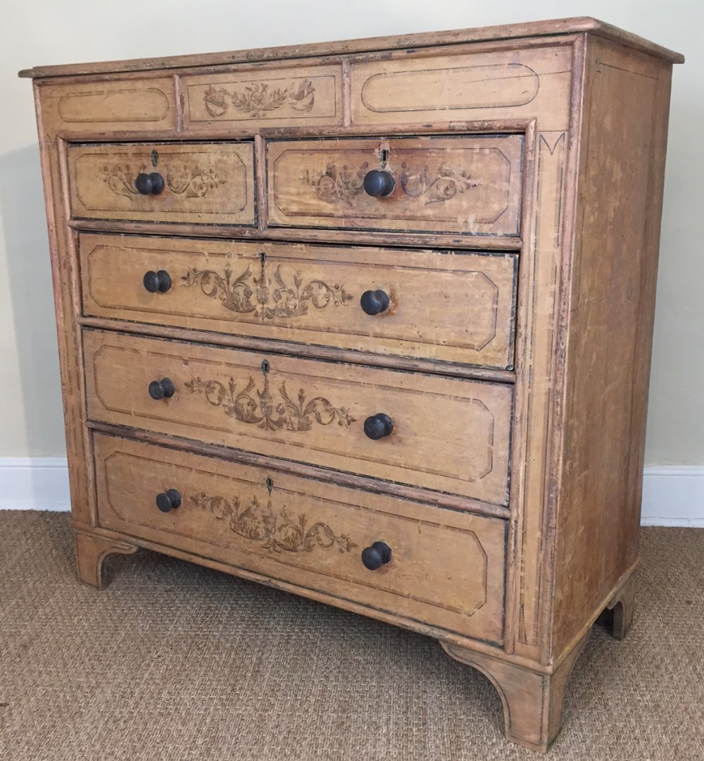 A late Regency painted pine chest of drawers c 1830 with all the original decoration.