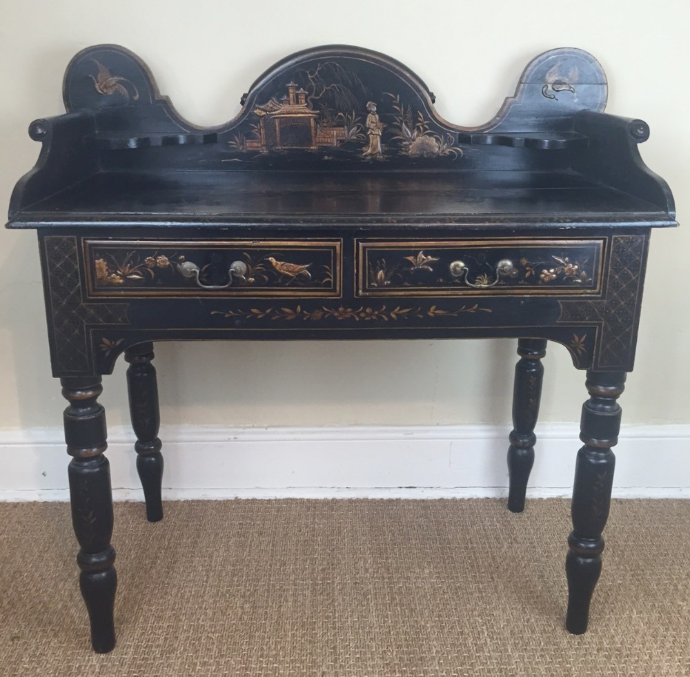 A late 19th century chinoiserie lacquer dressing table in early Georgian style.