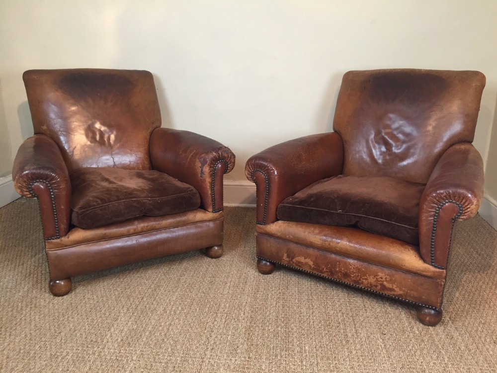 A pair of English leather armchairs c 1910 