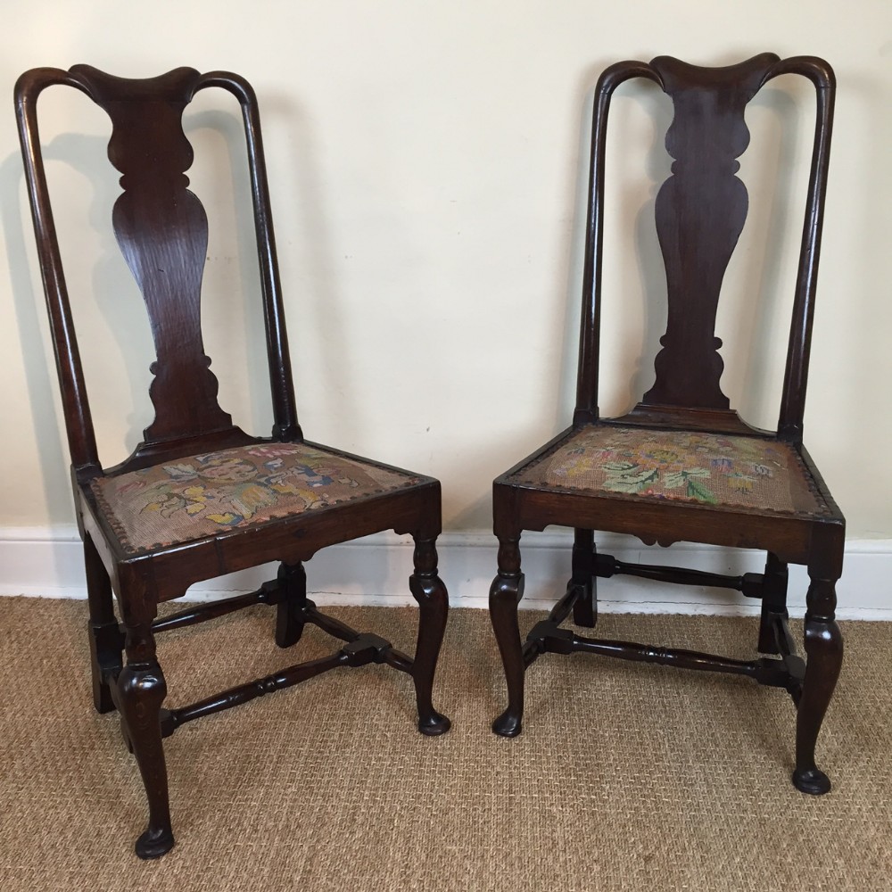 A pair of early George 11 oak side chairs c 1740