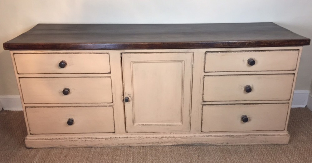 A Devon painted pine and birchwood dresser base c 1870