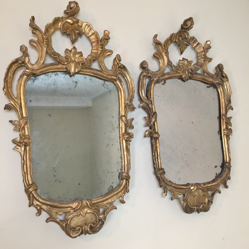 A pair of late 18th c North Italian gilt mirrors 