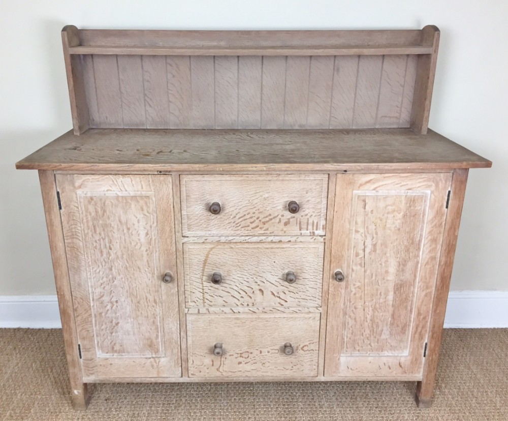 A rare early Heals oak dresser designed by Sir Ambrose Heal c 1910 