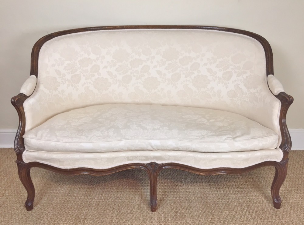 A small mid 19 century French walnut two seater sofa