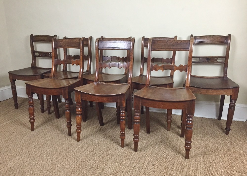 A harlequin set of 8 late Georgian elm country chairs circa 1820 