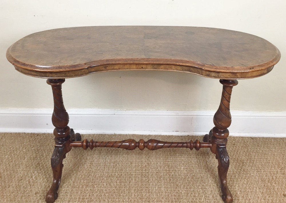A Victorian walnut kidney shaped writing table circa 1860 